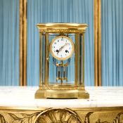 A LATE 19TH CENTURY GILT BRASS FOUR GLASS MANTEL CLOCK BY JAPY FRERES