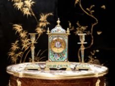 A LATE 19TH CENTURY FRENCH CHAMPLEVE ENAMEL CLOCK GARNITURE