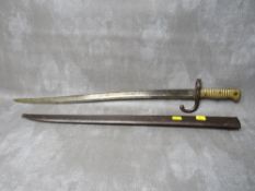 A FRENCH 19TH CENTURY CHASSPOT BAYONET, with brass grip, in steel scabbard, L 71 cm
