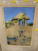 A framed watercolour of a mediterranean building, signed lower right