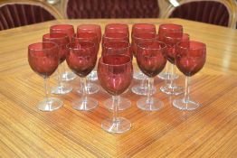 (16) Cristal St. Louis Cranberry to Clear Glass Wine Stems.