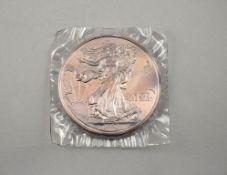 1990 American Eagle 1 Pound Silver Coin.