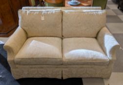 Beige Upholstered Loveseat.