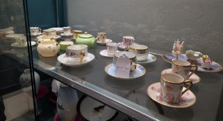 Shelf Of Porcelain Teacups And Saucers.