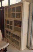 Contemporary White 6-Shelf Cabinet With Sliding Glass Doors.