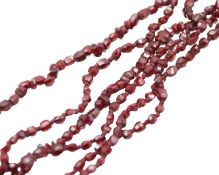 A very fine garnet bead necklace, and two strings of garnets.