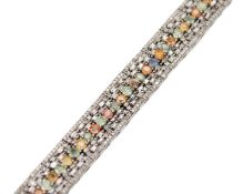 An Art Deco-style silver, sapphire, and diamond bracelet.