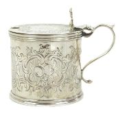 A Victorian silver mustard pot with blue glass liner by Arthur Sibley.