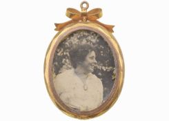 A 9k gold photograph locket pendant.