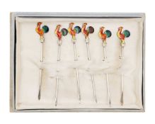 A set of six silver Hors d'oeuvres picks mounted with coloured enamel cockerel finials.
