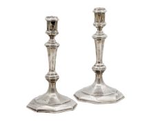 A good, heavy-gauge silver, pair of cast candlesticks by C J Vander Ltd.