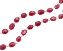 A dyed quartz and faux pearl bead necklace.
