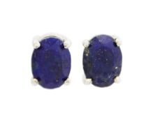 A pair of silver lapis lazuli stud earrings.