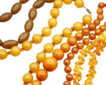 An assortment of amber and amber-style bead necklaces.