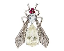 A silver, yellow beryl, aquamarine, ruby, and diamond fly brooch/pendant.