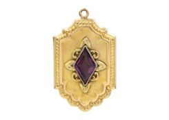 A gold-plated purple paste set locket fob.