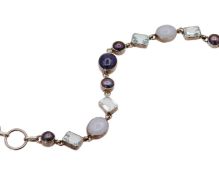 A silver bracelet with gemstones.