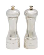 A pair of modern silver capstan form pepper mills by A J Poole.