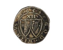 A Commonwealth 1653 silver shilling coin, mm. sun.