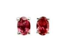 A pair of silver tourmaline stud earrings.