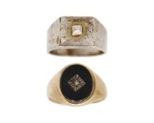A 9k gold, black onyx, and diamond signet ring, and a silver signet ring.