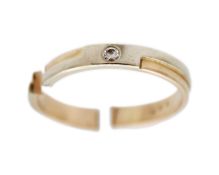 A broken 14k bi-colour gold ring set with a diamond.