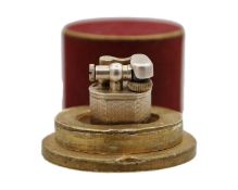 DUNHILL - A 'Baby Sylph' silver-plated engine turned miniature lighter.