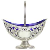 An Edwardian silver pedestal swing handled sweetmeat dish by Charles Westwood.