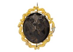 A Victorian carved jet 'lily of the valley' gold mounted brooch.