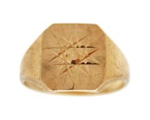 A 9k gold signet ring with an engraved star.
