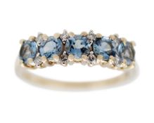 A 9k gold five-stone aquamarine and diamond ring.
