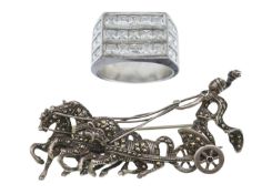 A silver and marcasite chariot brooch, and a silver CZ gentleman's ring.