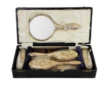 A cased George V silver six-piece dressing table set.