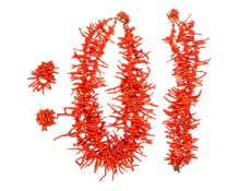 A red coral necklace and matching bracelet, with a pair of clip-on earrings.