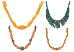 A selection of four bead necklaces.