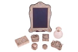 A collection of silver items, comprising of a silver-fronted easel photograph frame by Kitney & 