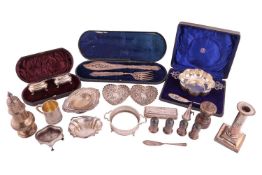 A collection of silver items; including examples of a George III silver christening mug stippled wit