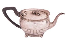 A 19th-century Dutch teapot, of boat form with reeded border, the half-lobed oval body engraved with