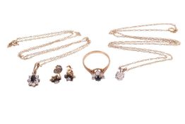 A diamond pendant and a sapphire and cubic zirconia demi-parure; The diamond pendant with an estimat