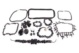 A collection of jet and jet imitation jewellery, comprising of a jet necklace of foliate design as w