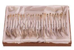 A set of twelve Danish teaspoons and cake forks by W & S Sorensen, each with gilt finials, stamp