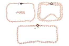 Three cultured pearl necklaces; A single strand cultured pearl necklace, pearls measuring approximat