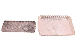 An Art Nouveau style silver dressing table tray, the centre with repousse bouquet of roses within a 