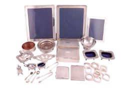 A large silver mounted photograph frame with a beaded border, 30cm x 25cm, another with ribbon borde