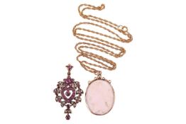 A cameo pendant on chain and another set with ruby and diamonds; the oval white shell panel carved w