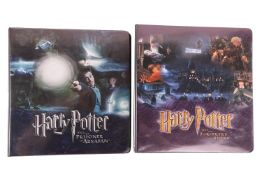 Harry Potter: Two albums of Artbox trading cards, Harry Potter and the Sorcerer's Stone; and Harry P