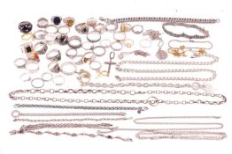 A large quantity of jewellery; to include a Chrome Hearts ring, a heavy curb link chain, a simulated