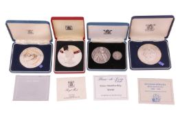 Three silver medals and a silver proof, comprising; a Spanish Armarda 400th Anniversary silver comme