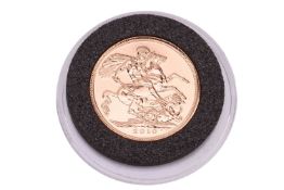 A Queen Elizabeth II 2010 sovereign, in capsule, with outer pouch.