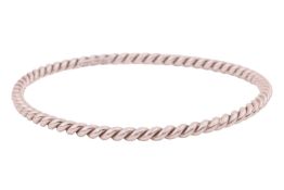 Tiffany & Co. - a closed bangle of twisted rope design, in white metal marked 'ITALY 925', signe